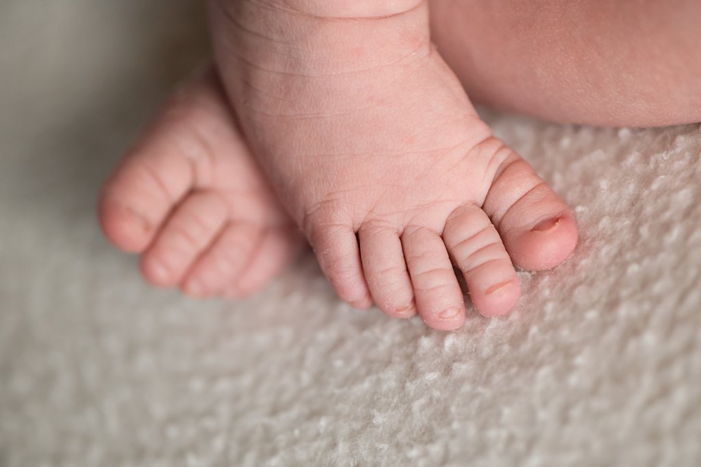 Newborn baby girl at home with her new family.